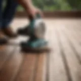 A powerful sander in action on a wooden deck