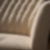 A close-up of a stain on a light-colored fabric upholstery