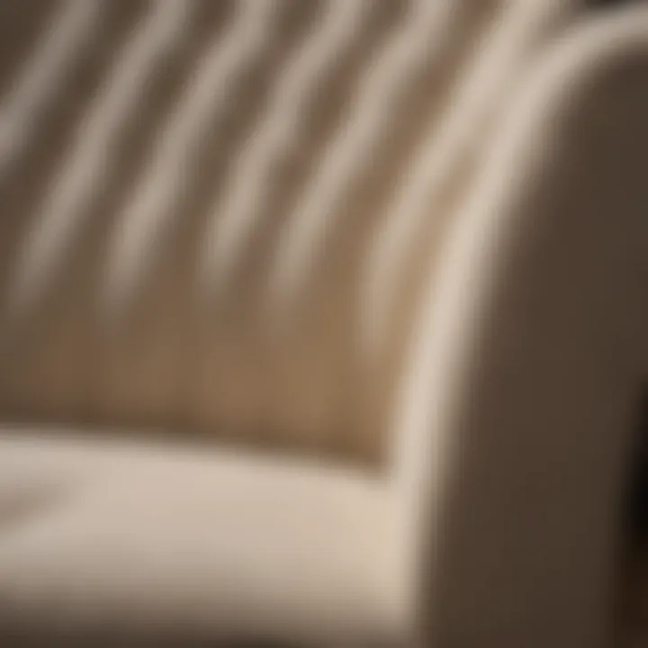 A close-up of a stain on a light-colored fabric upholstery
