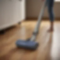 Cordless vacuum on hardwood floor demonstrating hair removal efficiency