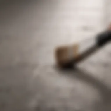 Close-up of paintbrush applying paint to a ceramic tile surface