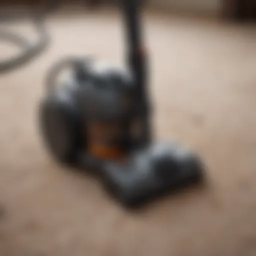 Traditional manual vacuum cleaner in action on a carpet