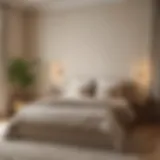 A serene bedroom featuring soft beige walls and cozy linens.