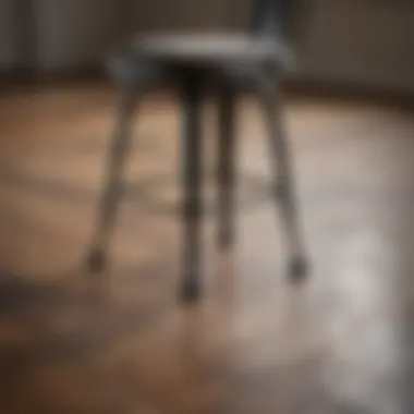 Protective pads under metal chair legs on wood floor